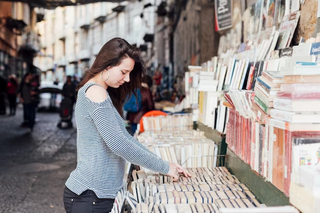 Woman buying a book in the market