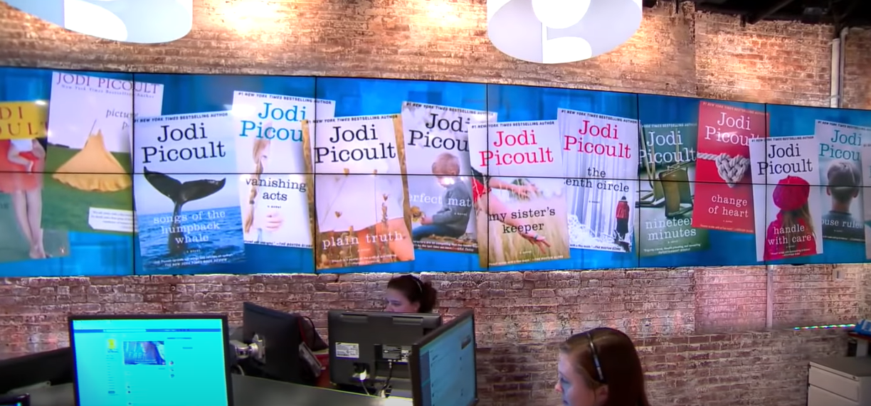 Books by Jodi Picoult shown on the screen